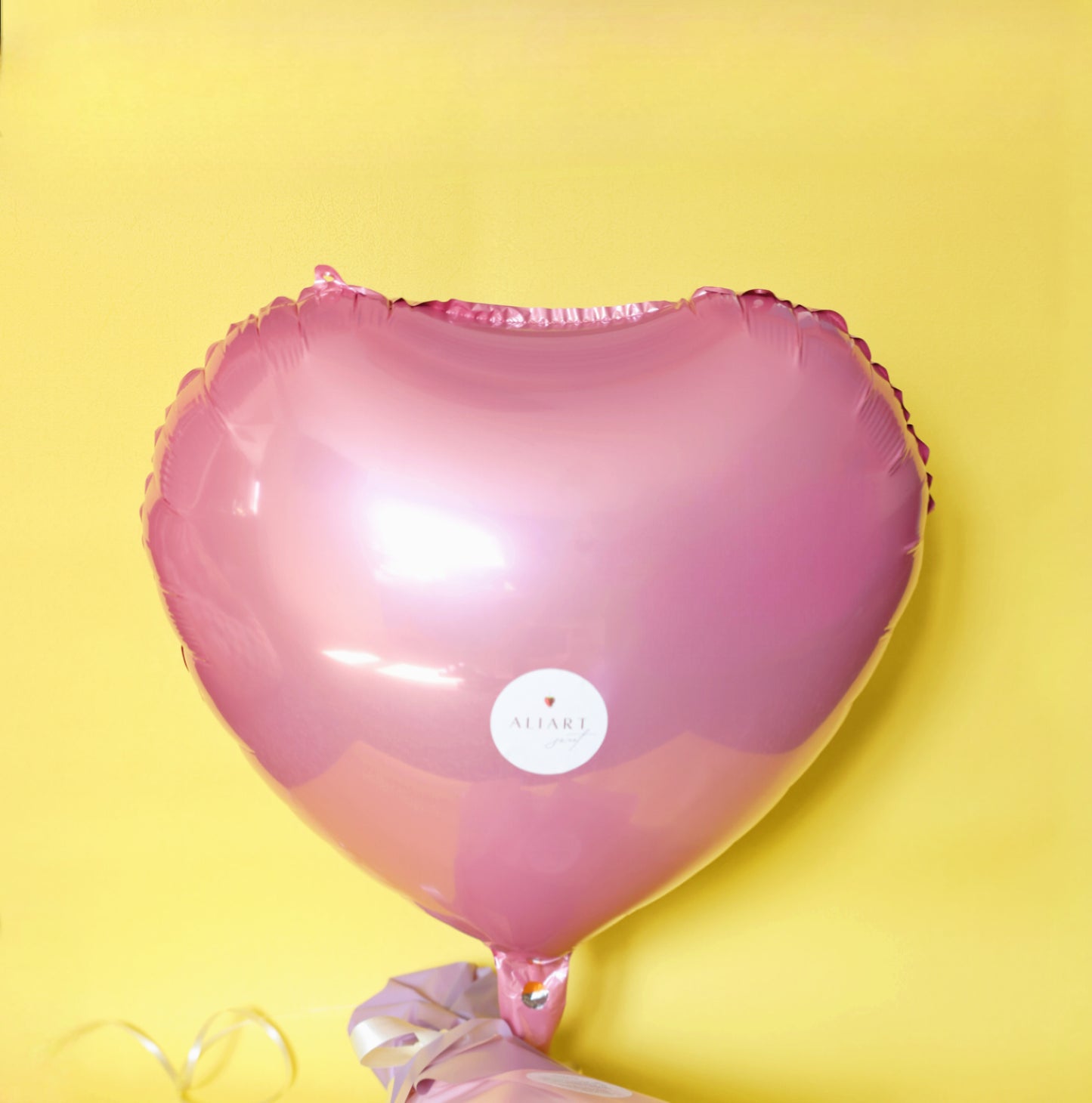 Bright helium balloon floating against a festive backdrop, perfect for creating a joyful atmosphere at your event.