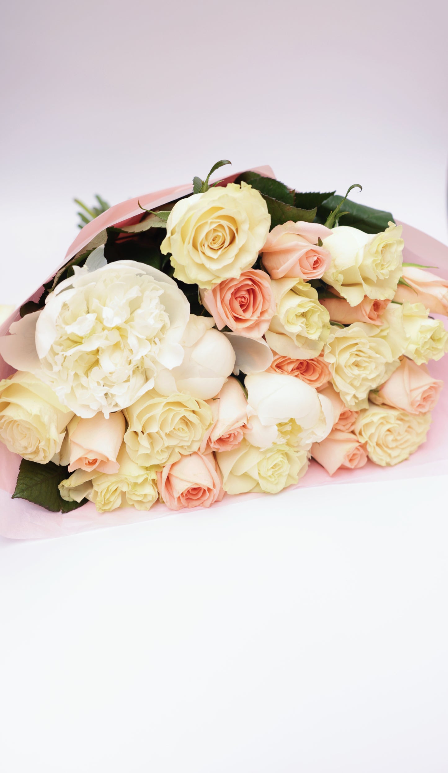Brighten someone's day with our beautiful bouquet of roses and seasonal flowers, accompanied by a personalized greeting card. This stunning arrangement features fresh, vibrant roses mixed with an assortment of seasonal blooms, creating a perfect blend of colors and fragrances. The bouquet, paired with a heartfelt greeting card, makes for an exquisite gift suitable for any special occasion.