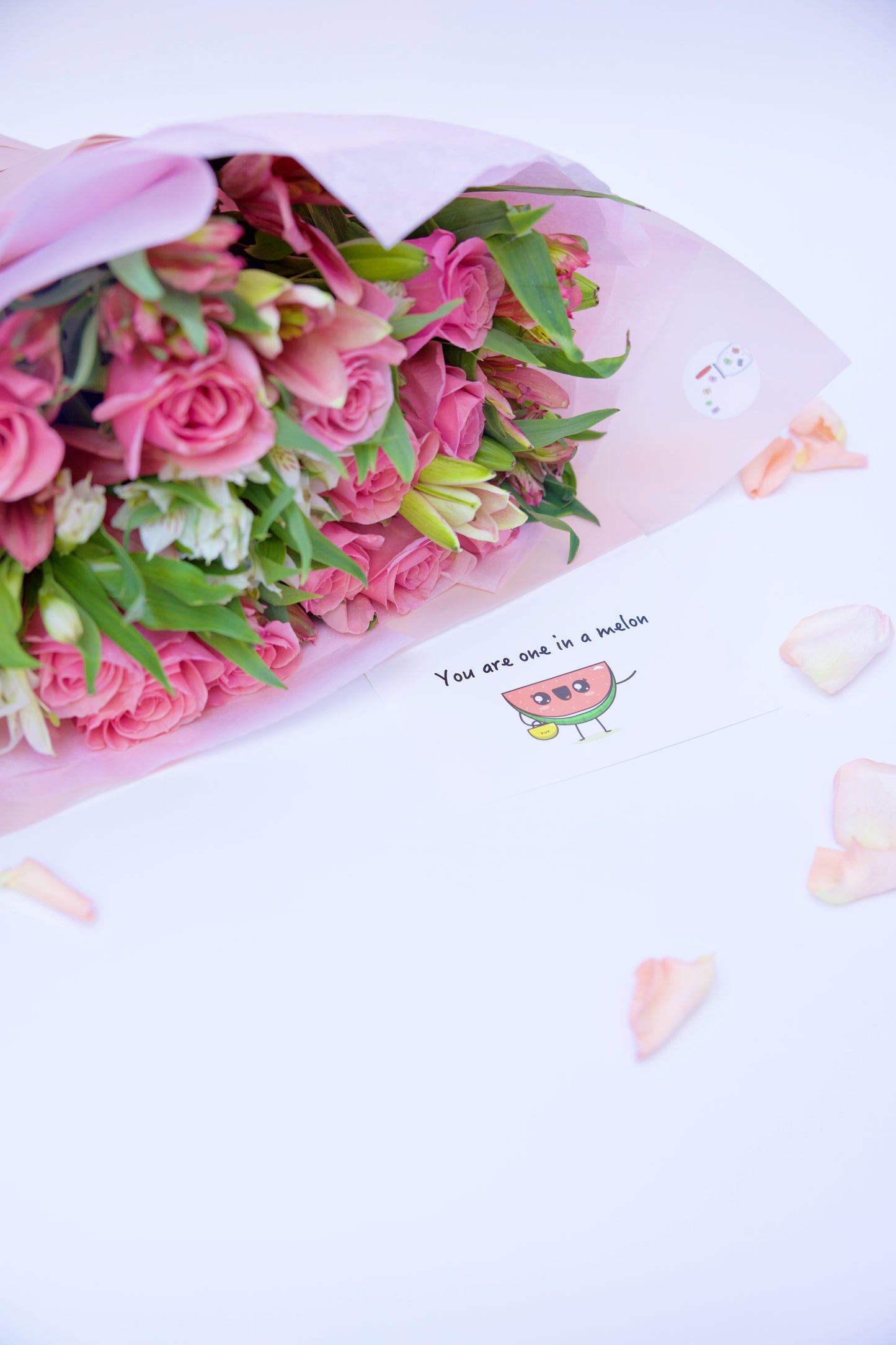 Enchant your loved ones with our Roses and Seasonal Flowers bouquet. This captivating arrangement blends classic roses with the freshest seasonal blooms, creating a vibrant and stunning display. Order now to brighten someone's day with this beautiful bouquet!