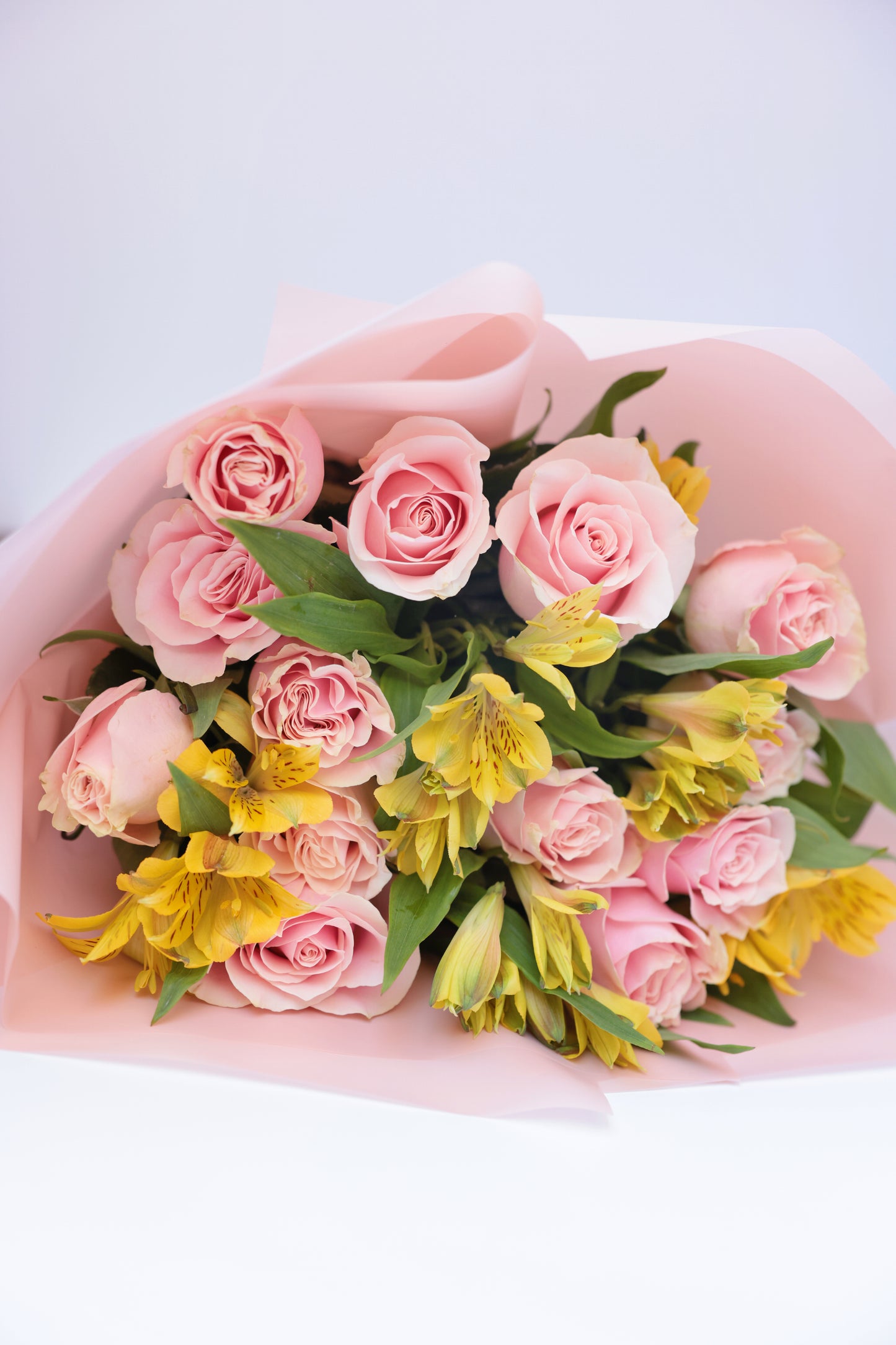 Brighten someone's day with our beautiful bouquet of roses and seasonal flowers, accompanied by a personalized greeting card. This stunning arrangement features fresh, vibrant roses mixed with an assortment of seasonal blooms, creating a perfect blend of colors and fragrances. The bouquet, paired with a heartfelt greeting card, makes for an exquisite gift suitable for any special occasion.