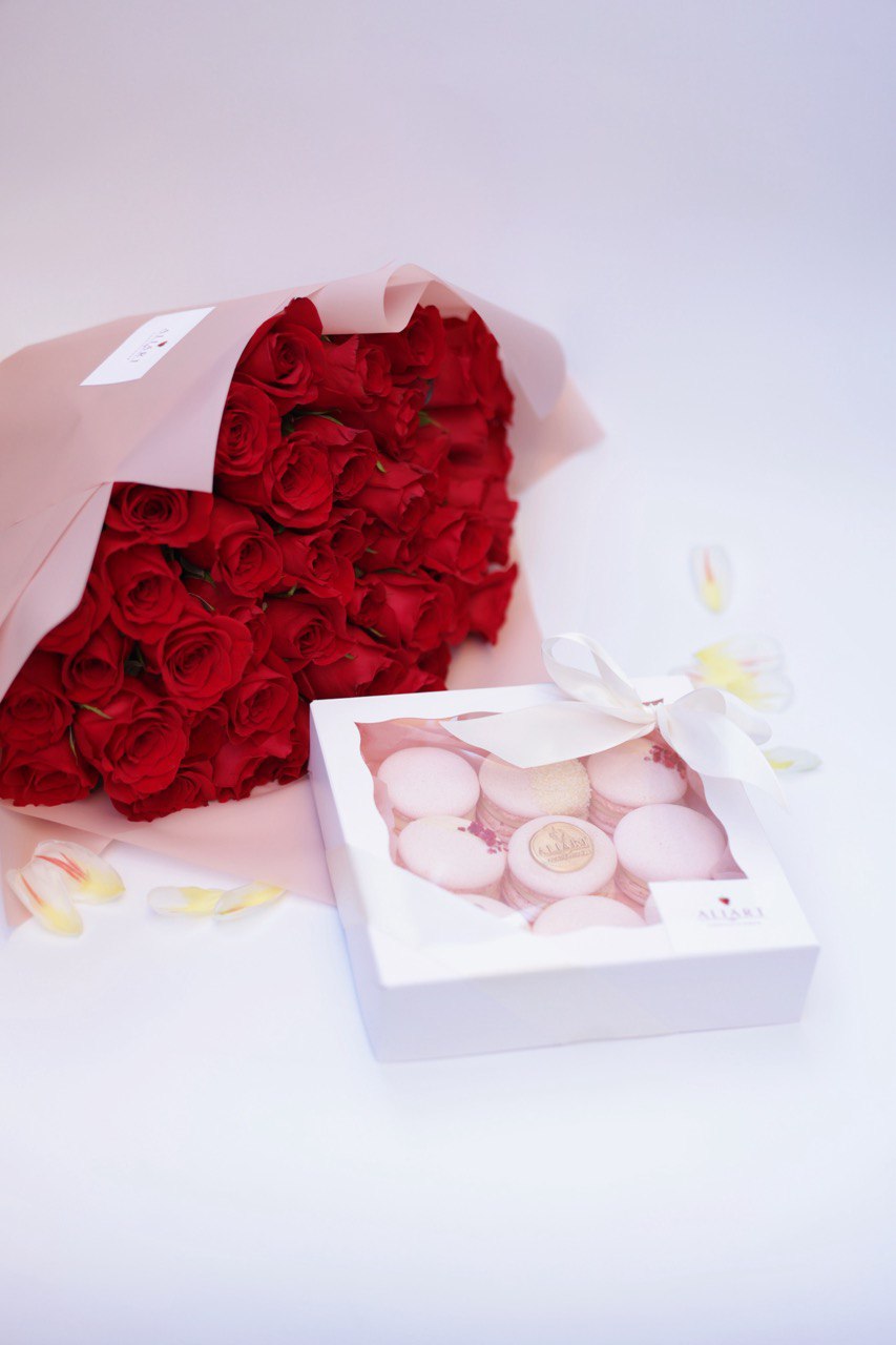 Surprise someone special with our elegant set featuring a bouquet of fresh roses, a selection of delicate macarons, and a personalized greeting card. The vibrant roses add a touch of natural beauty and fragrance, while the assorted macarons offer a delightful array of flavors and colors. This thoughtfully arranged set, complete with a heartfelt greeting card, is perfect for any occasion, expressing your sentiments with style and sweetness.
