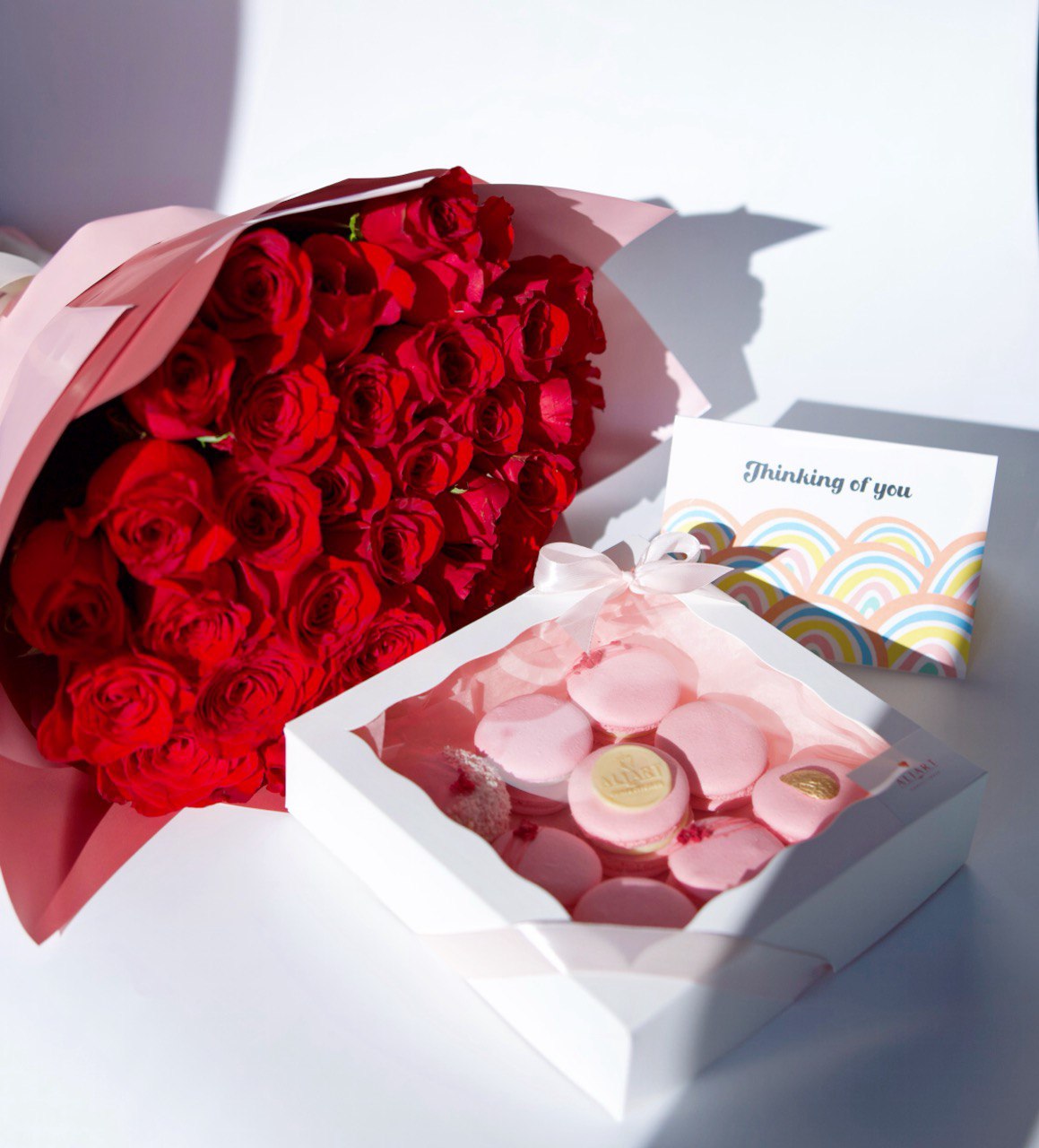 Surprise someone special with our elegant set featuring a bouquet of fresh roses, a selection of delicate macarons, and a personalized greeting card. The vibrant roses add a touch of natural beauty and fragrance, while the assorted macarons offer a delightful array of flavors and colors. This thoughtfully arranged set, complete with a heartfelt greeting card, is perfect for any occasion, expressing your sentiments with style and sweetness.