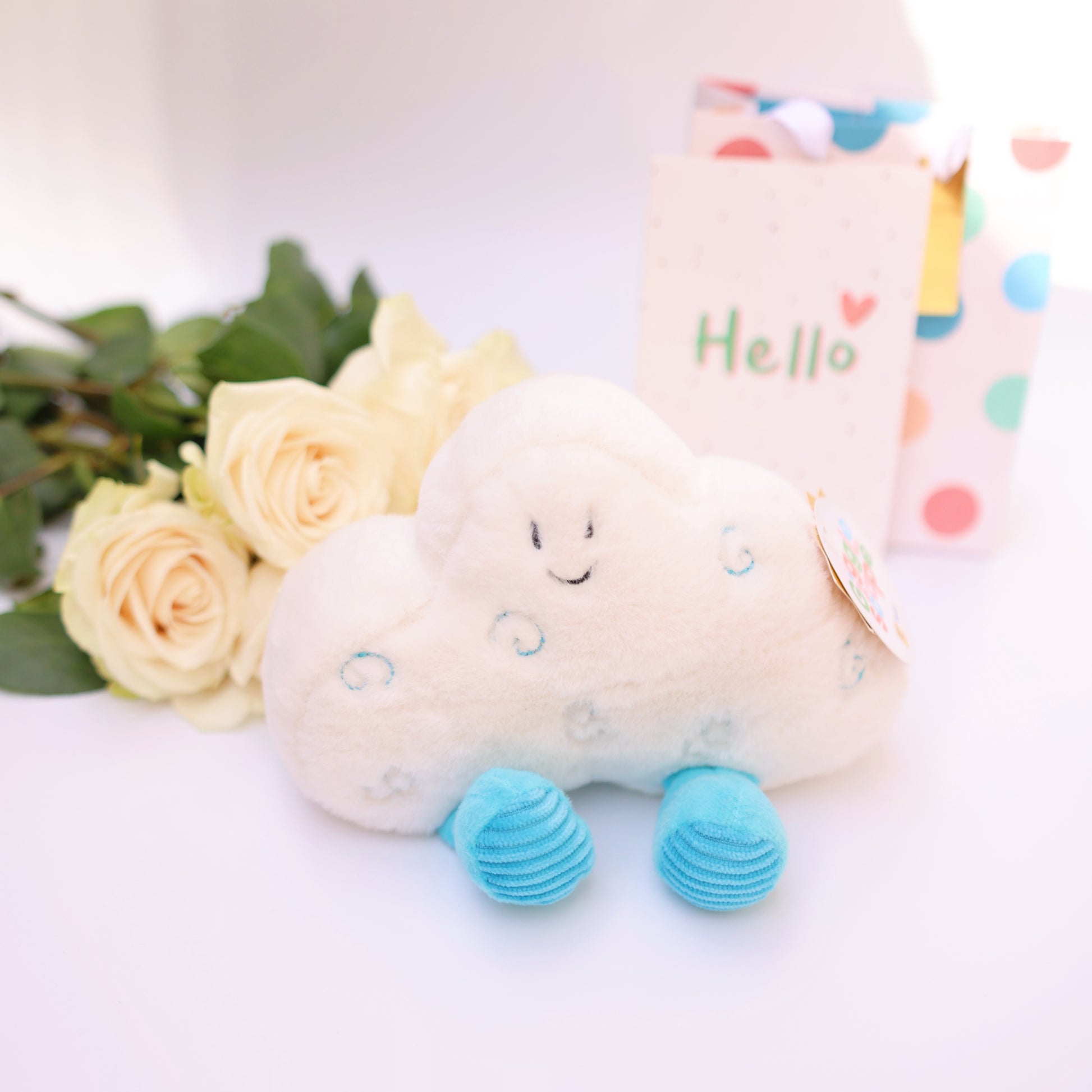 Adorable soft plush toy with blue feet and a happy smiling face, ideal for gifting.