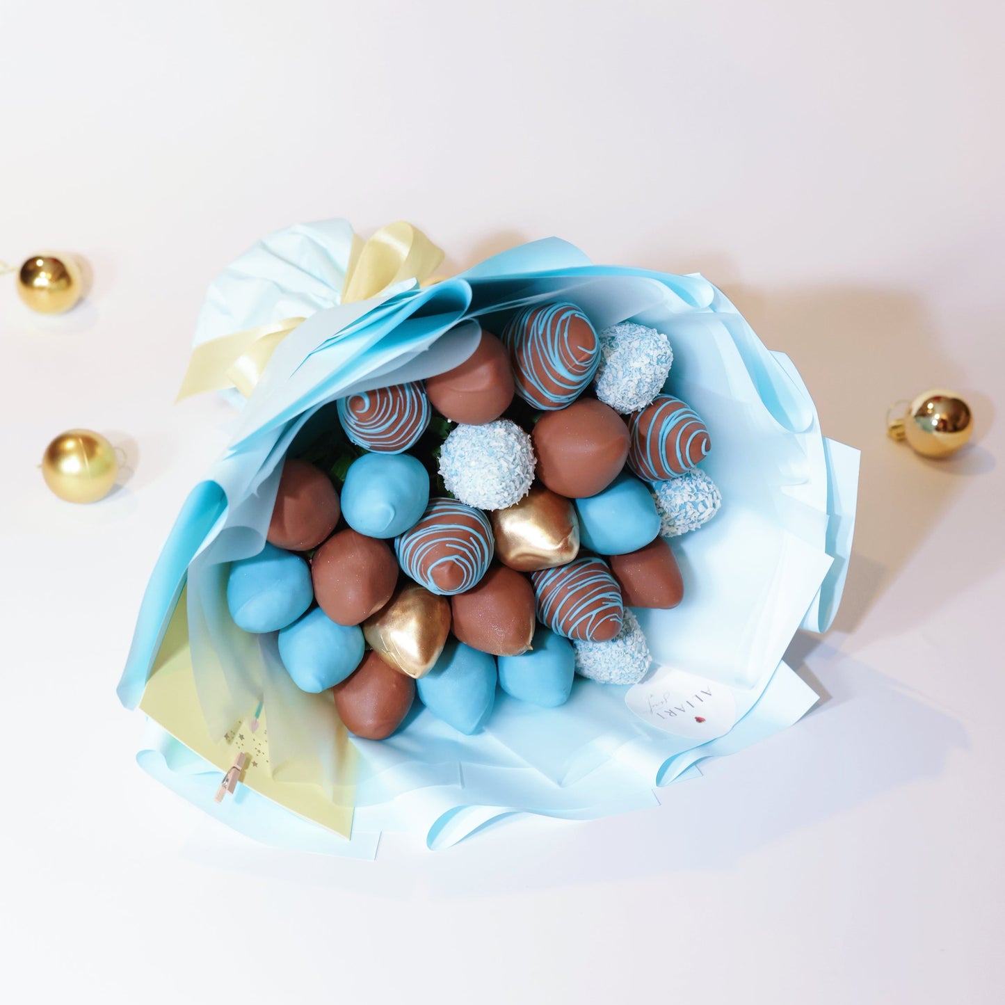 Chocolate-covered strawberry bouquet in milk and blue chocolate with gold accents, gift-wrapped, New York dessert delivery