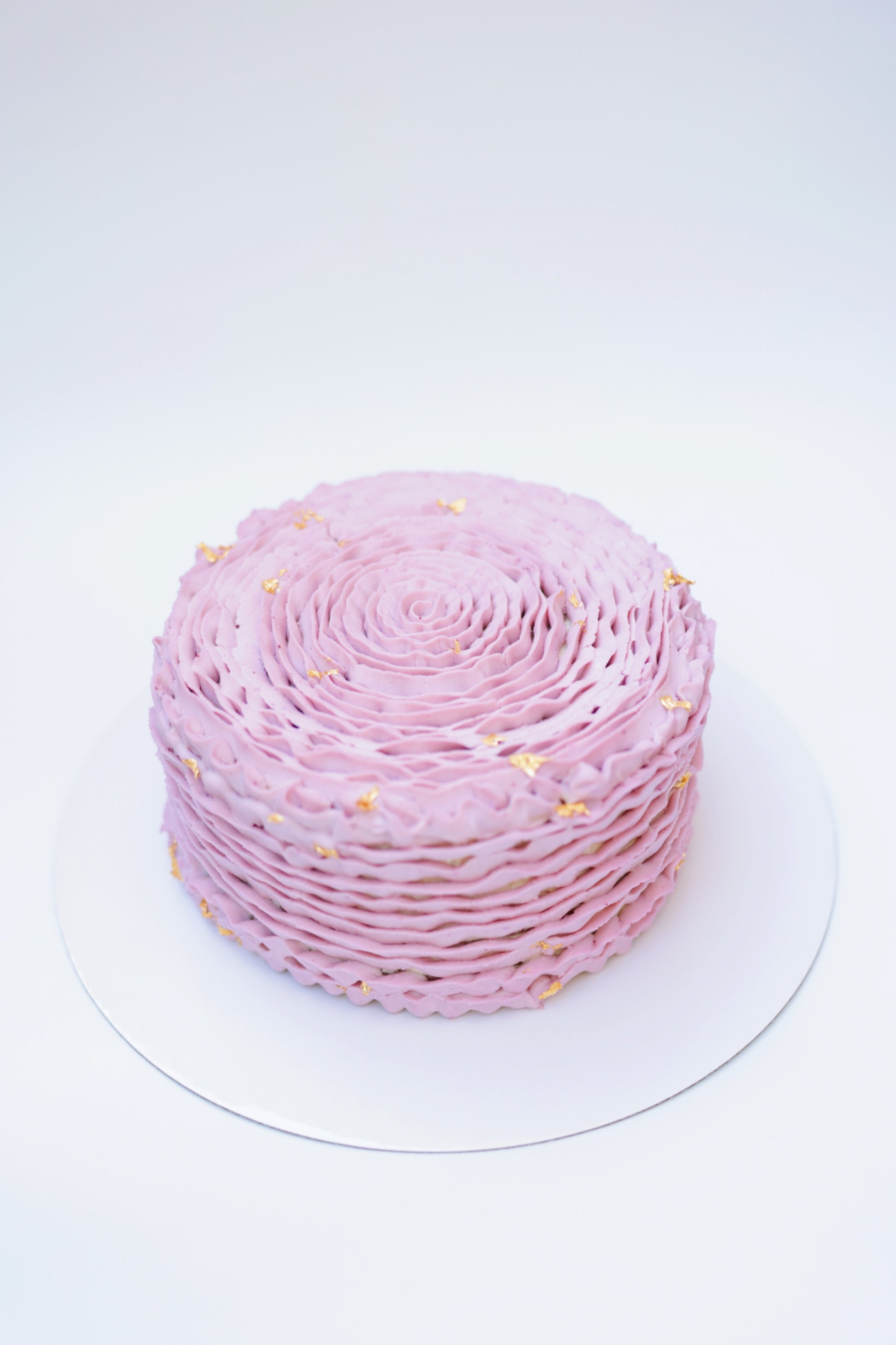 Indulge in elegance with our Soft-Pink Rose Honey Cake. Featuring layers of delicate honey-infused sponge and creamy frosting, all adorned with beautiful soft-pink rose decorations. Perfect for any special occasion. Order now to delight your senses and impress your guests!