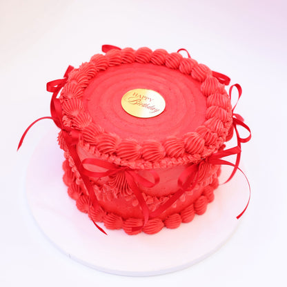 Strawberry honey cake with pink buttercream and fresh strawberry filling