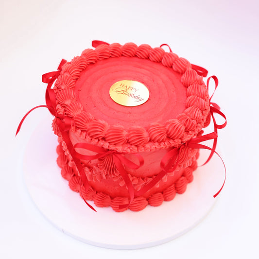 Strawberry honey cake with pink buttercream and fresh strawberry filling