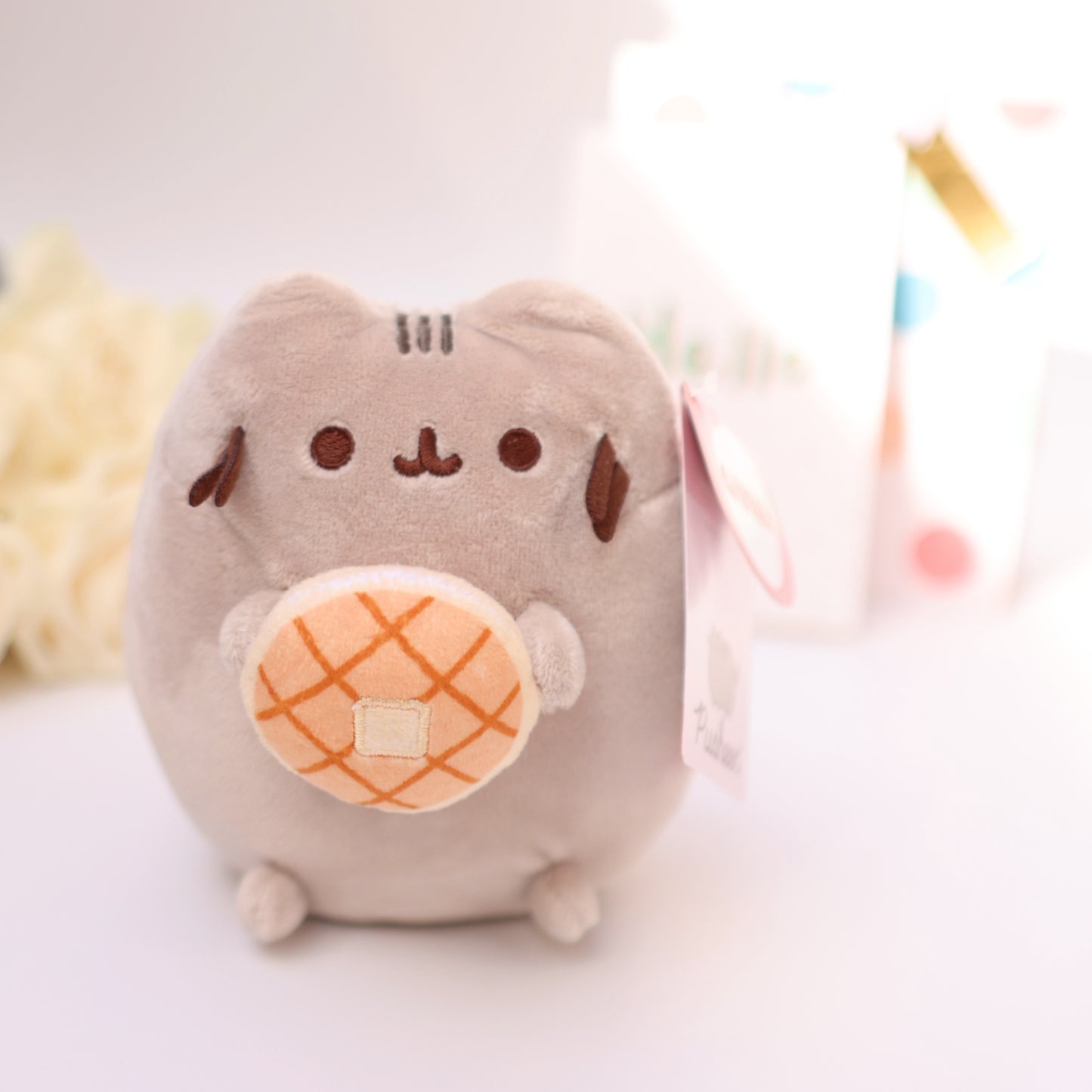Cute plush kitty with a donut, soft kawaii toy perfect as a gift or add-on for bouquets and sweets.