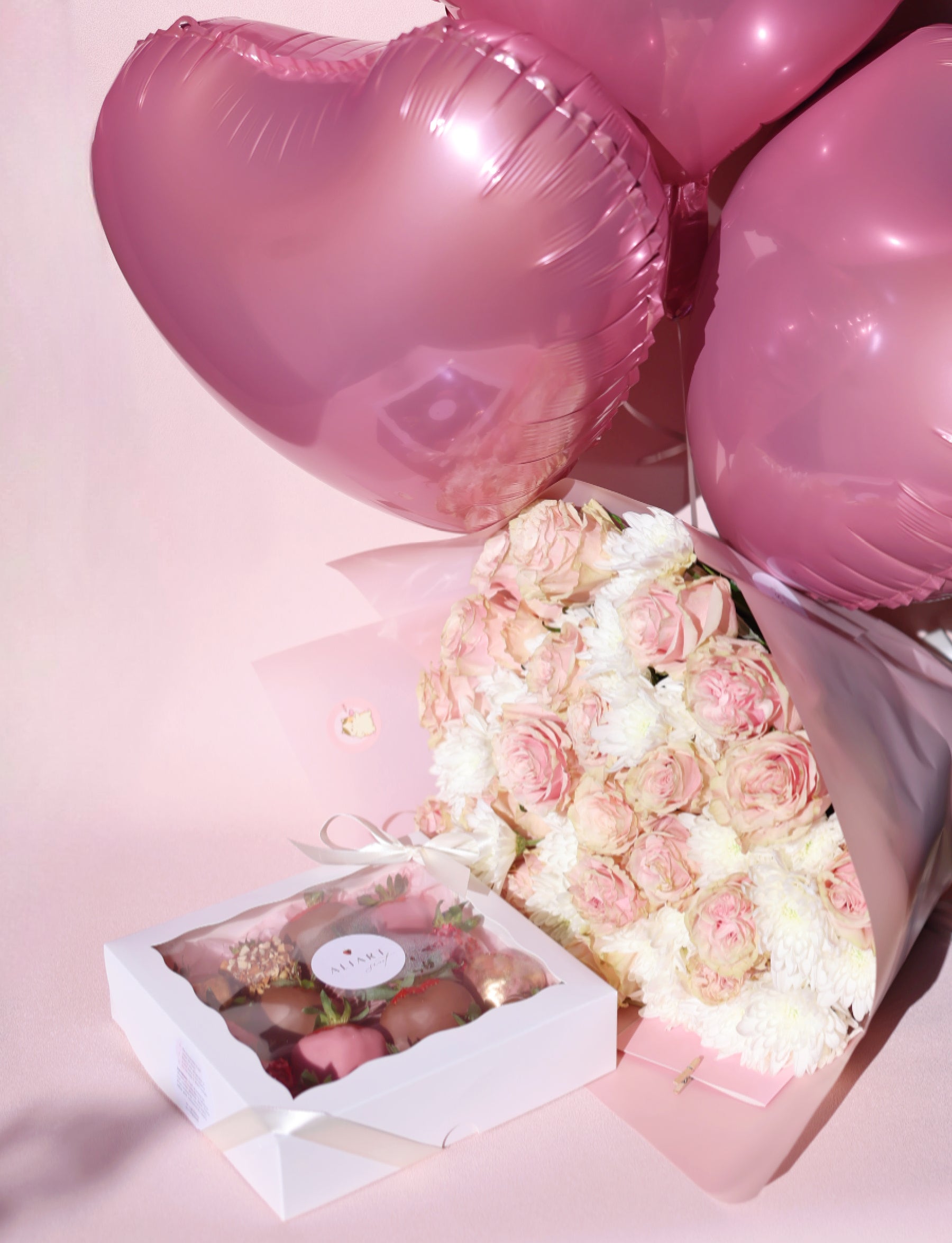 romantic gift set with bouquet and chocolate strawberries
