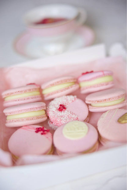 Indulge in the delightful fusion of tropical and rich flavors with our box of macarons filled with luscious mango filling and elegantly decorated with Belgian chocolate. Each macaron shell is perfectly crisp on the outside and soft on the inside, encasing a creamy passion fruit filling that bursts with fruity goodness. The Belgian chocolate drizzle adds a touch of decadence, making this box of macarons an exquisite treat for any occasion.