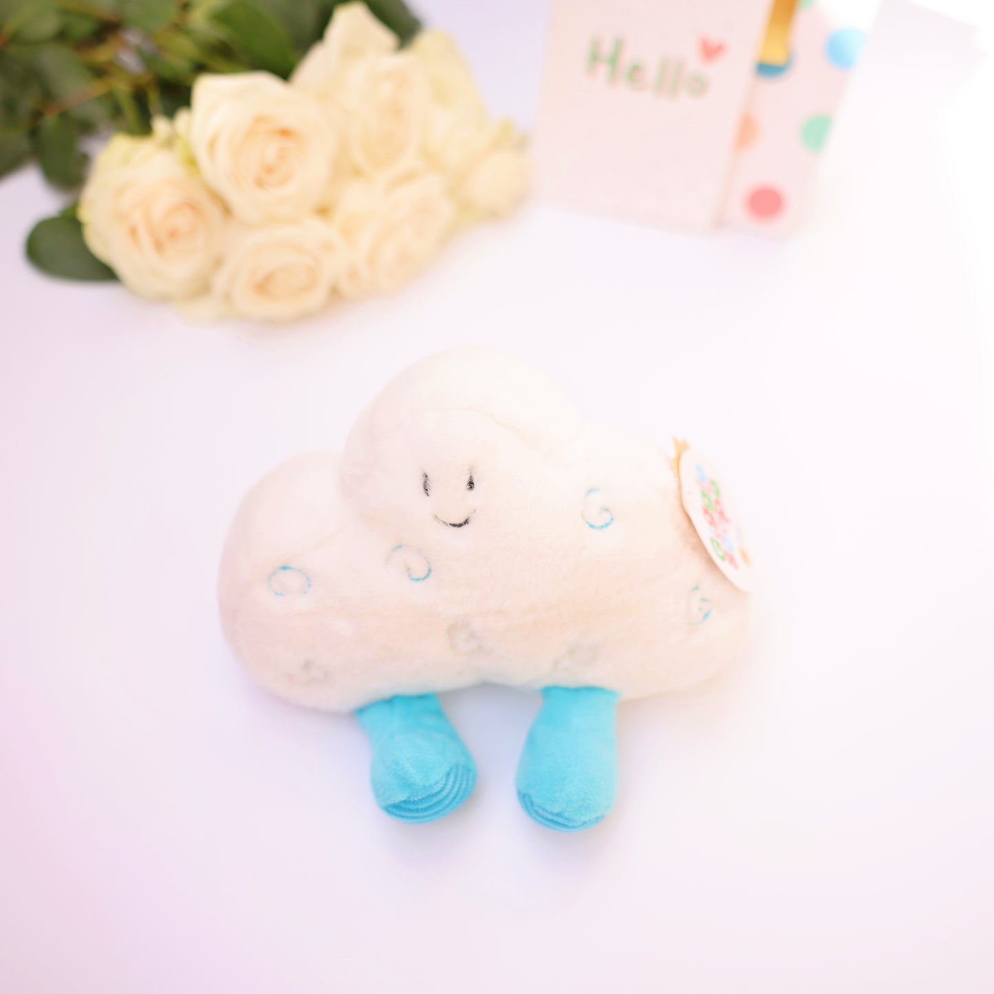 Soft, charming plush toy with blue feet and a warm smiling face, a lovely accessory to elevate any gift.