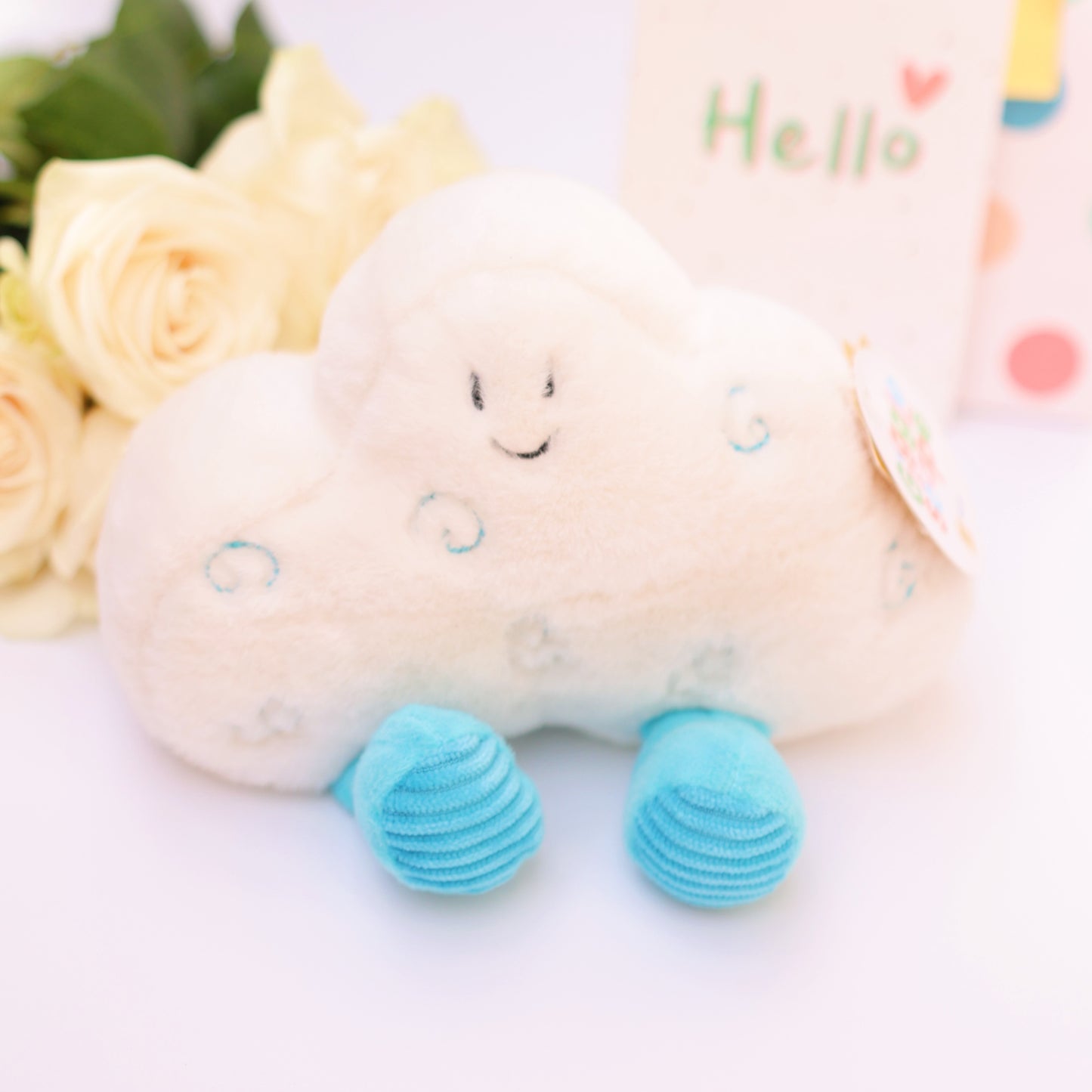 Cute plush toy with blue feet and a smiling face, perfect as a gift.
